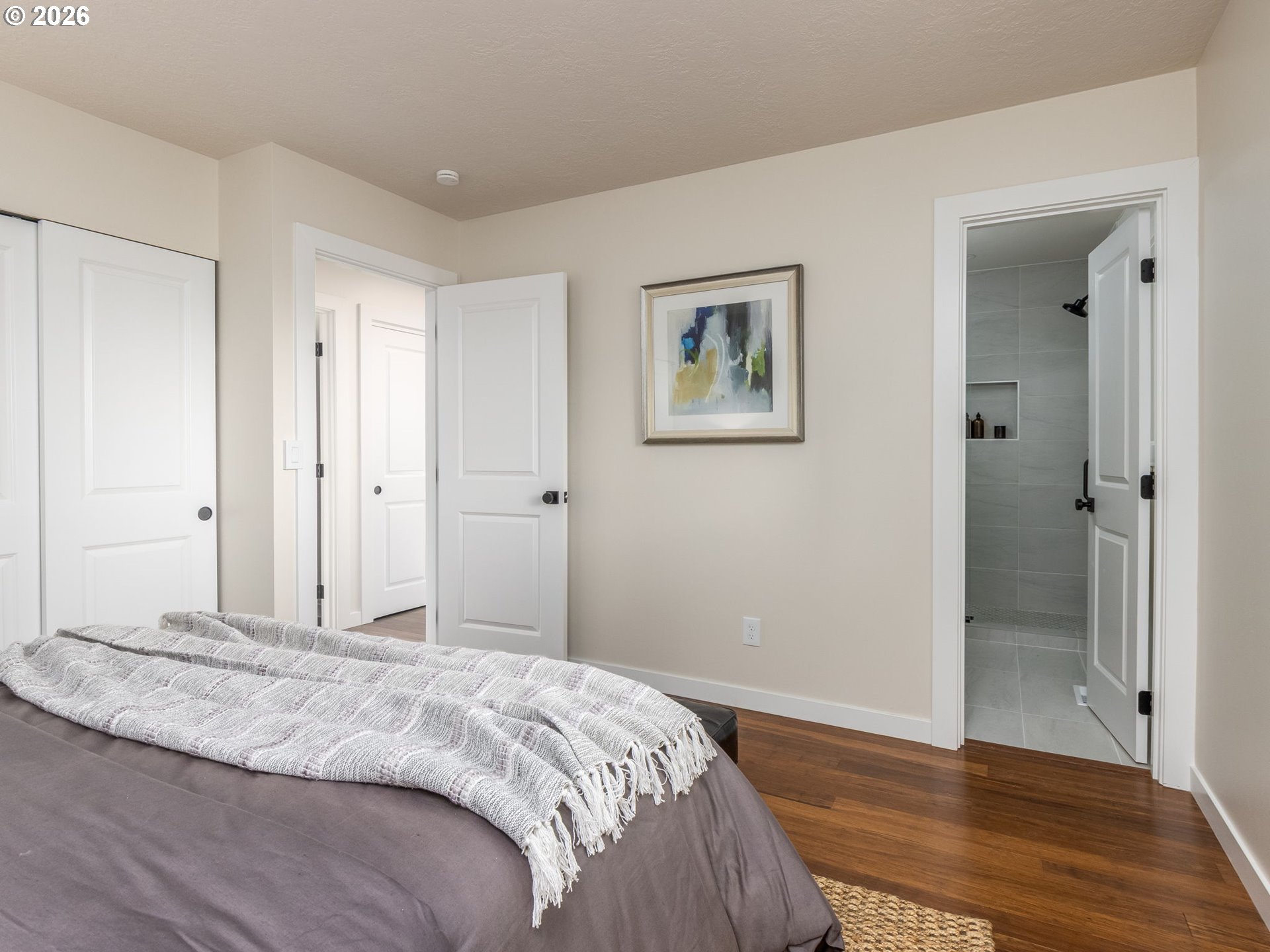 850 Northeast 179th Avenue Portland, OR 97230 - Photo 26 of 30 a bedroom with a bed and wooden floor