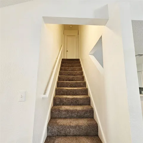 a bathroom with a sink toilet vanity granite tub and shower