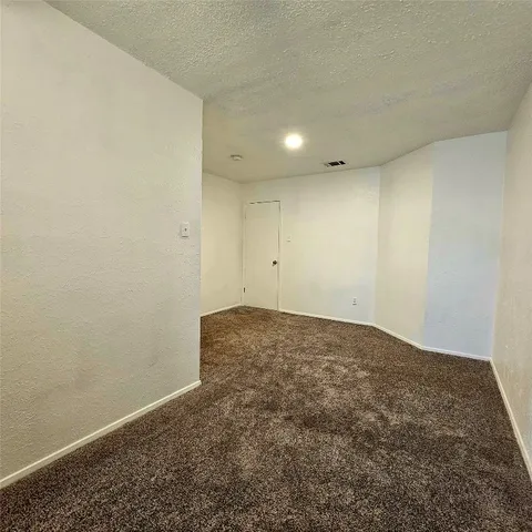 a view of a tree in a yard