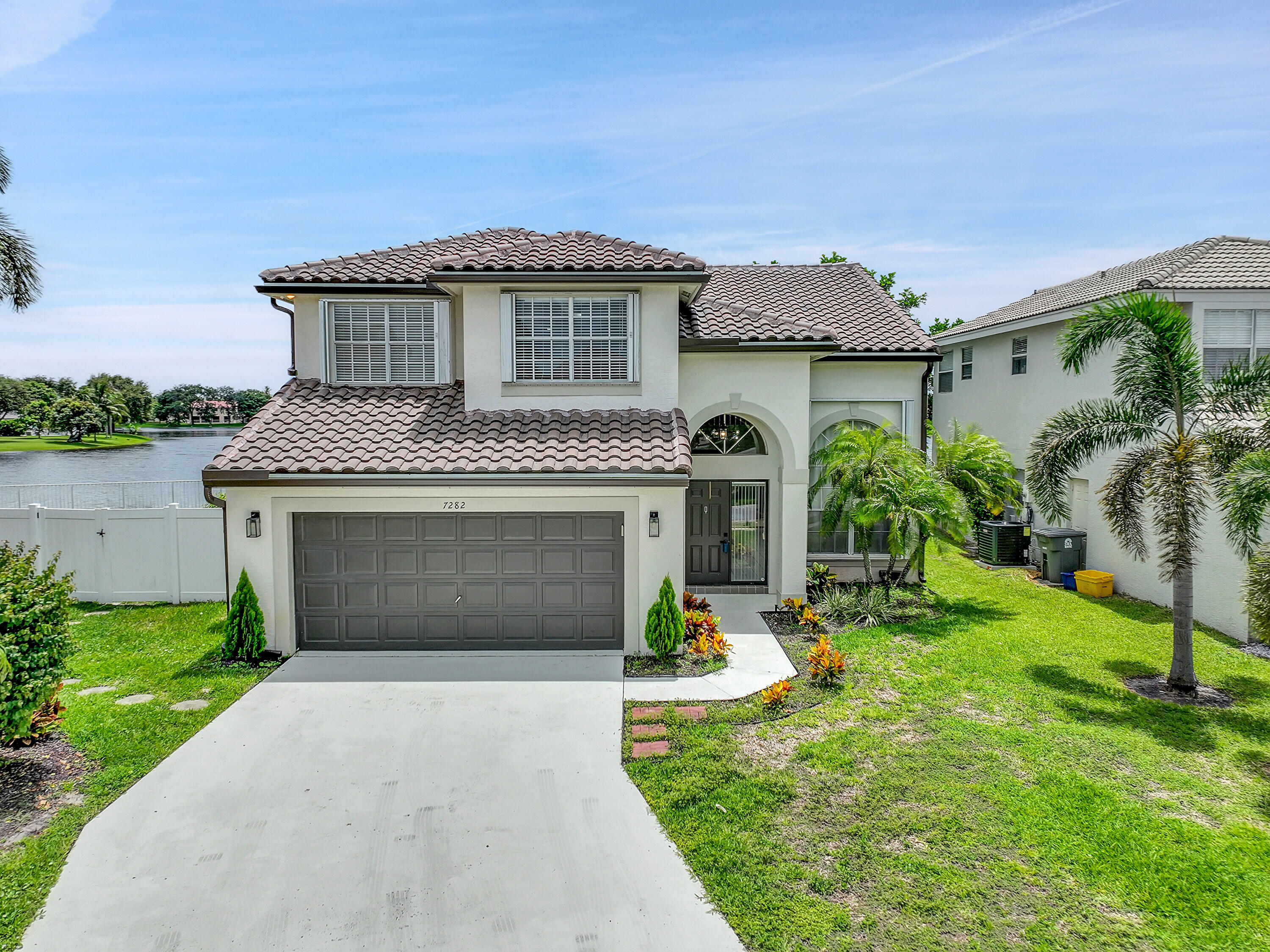 7282 Michigan Isle Road Lake Worth, FL 33467 - Photo 1 of 43 Front