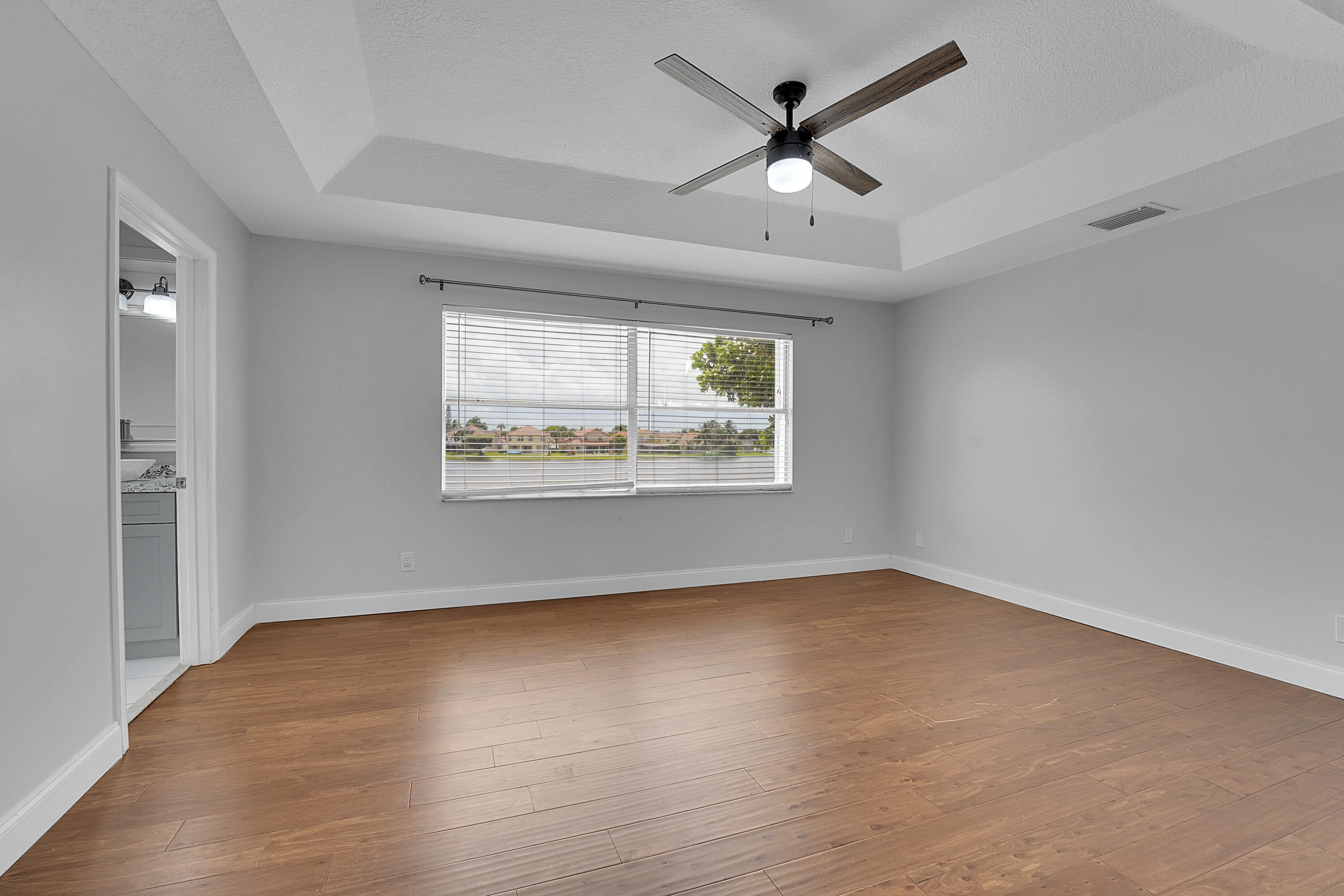 7282 Michigan Isle Road Lake Worth, FL 33467 - Photo 22 of 43 23_primary bedroom