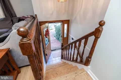 a view of an entryway with wooden floor