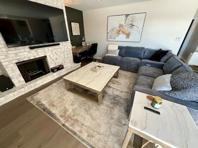 a living room with furniture and a flat screen tv