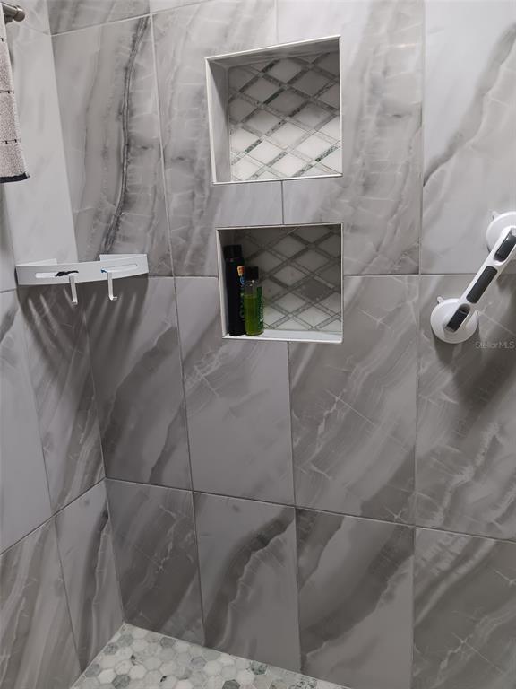 833 Channing Road Lakeland, FL 33805 - Photo 15 of 16 a bathroom with a sink and a fireplace