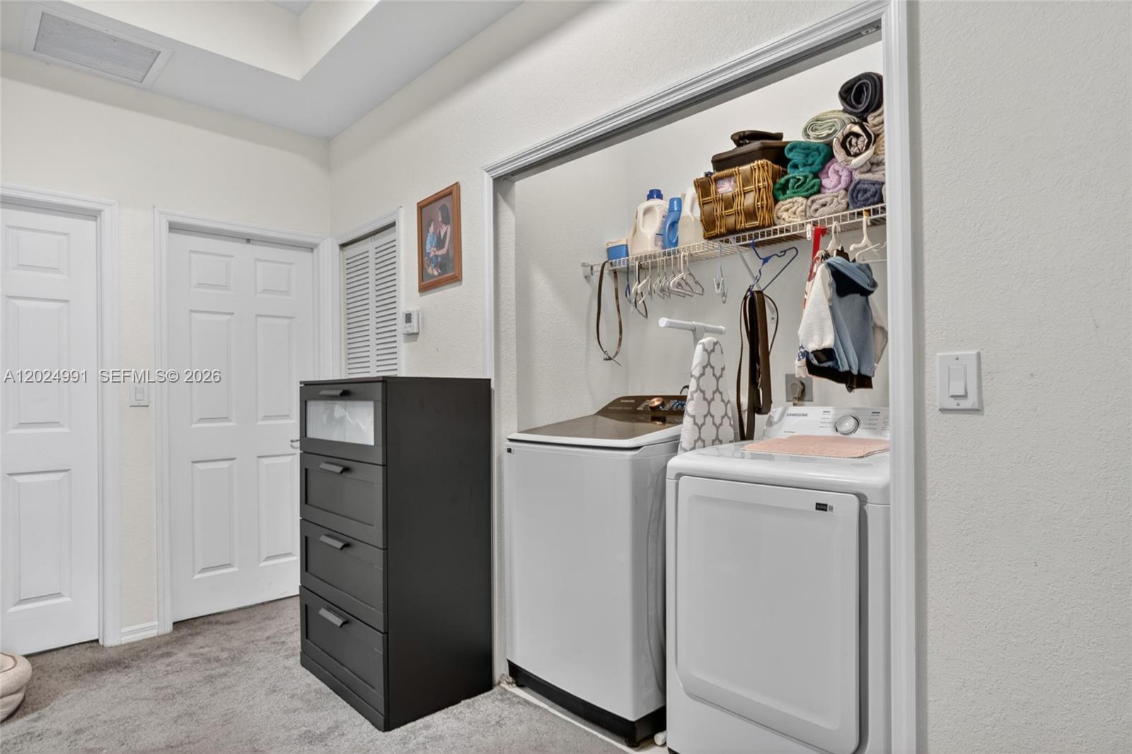 16651 Southwest 79th Terrace Miami, FL 33193 - Photo 23 of 34 a view of walk in closet with clothes and shoes