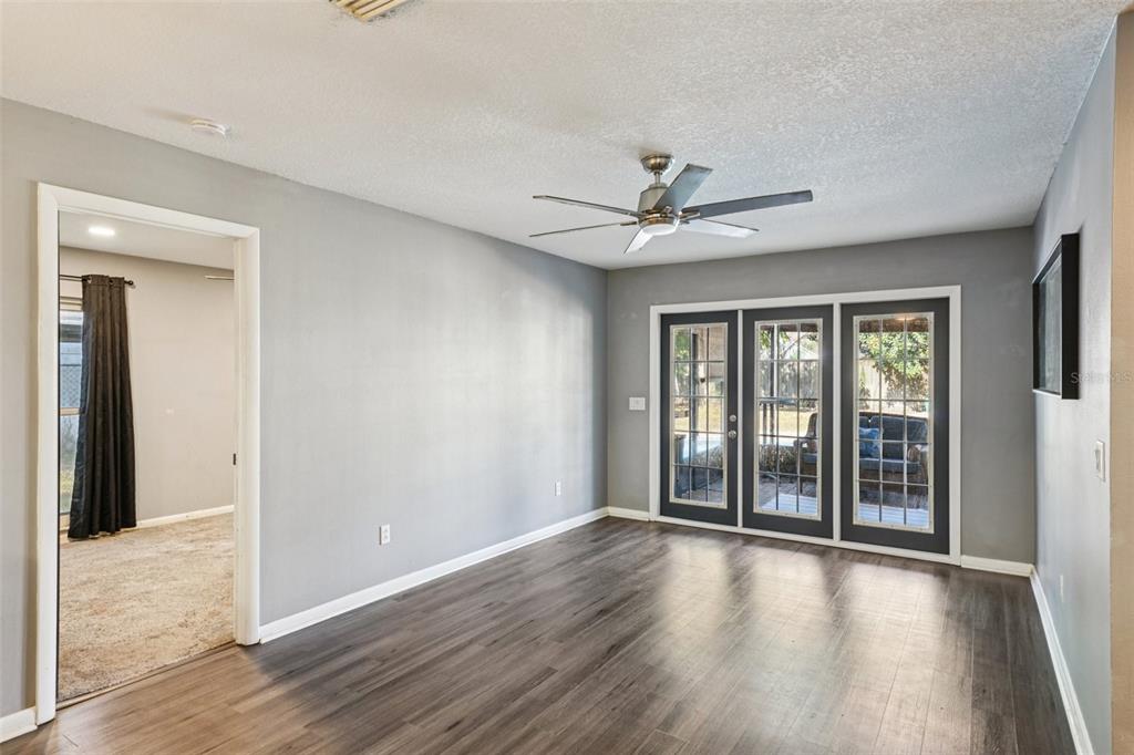 2015 Ronald Circle Seffner, FL 33584 - Photo 11 of 27 a view of an empty room with wooden floor and a window
