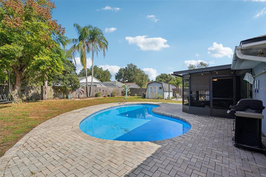 2015 Ronald Circle Seffner, FL 33584 - Photo 4 of 27 a swimming pool with outdoor seating and yard