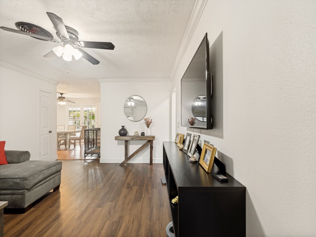 124 Bluebird Lane Pasadena, TX 77502 - Photo 17 of 25 a living room with furniture and a wooden floor