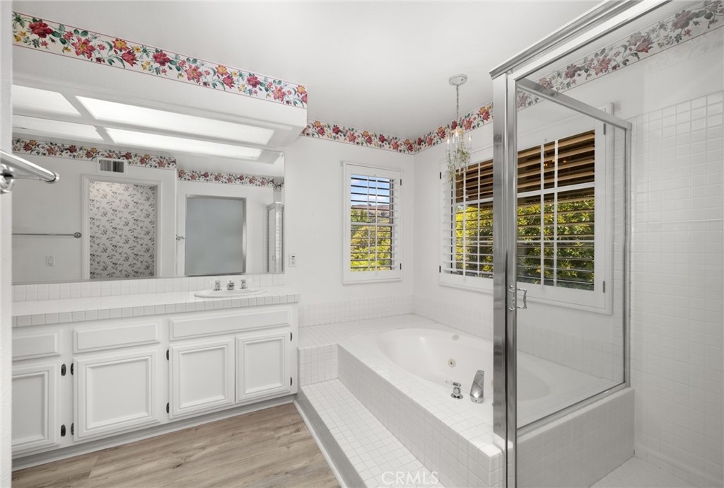 15971 Ranch House Road Chino Hills, CA 91709 - Photo 26 of 48 Primary bathroom en-suite with dual vanity, walk-in shower and soaking tub.