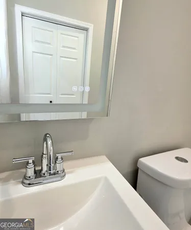 a bathroom with a sink and a toilet