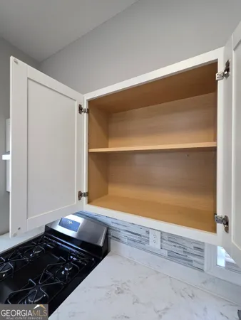 a room with a closet and wooden floor