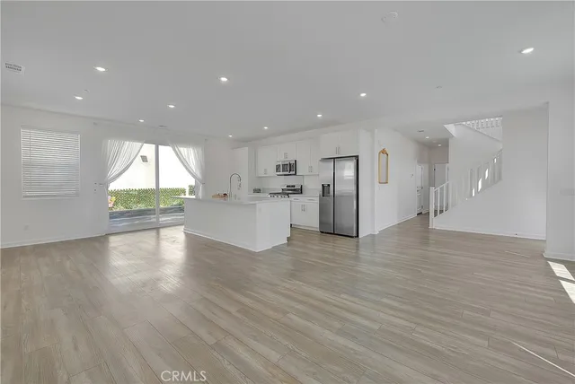 a view of an empty room and a window