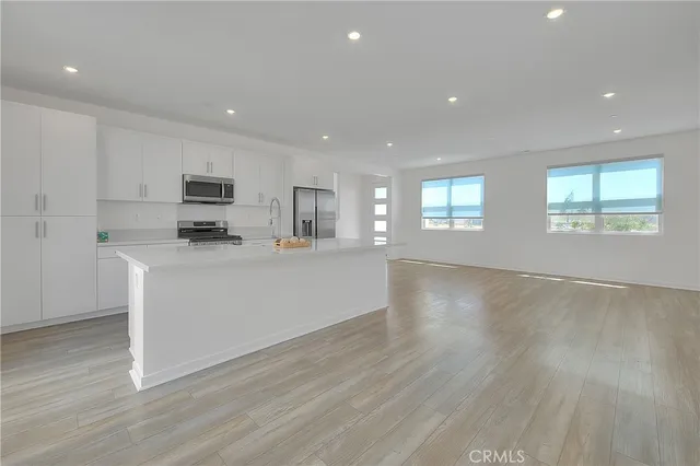 a white bath tub sitting next to a shower
