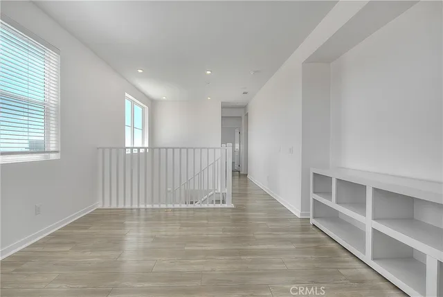 a large kitchen with kitchen island a sink appliances and a counter top space