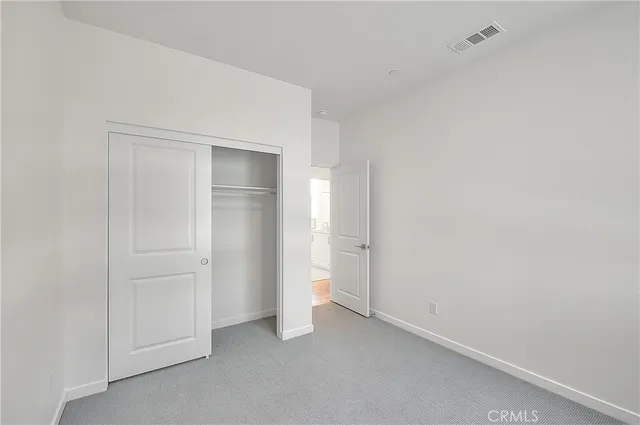 a living room with furniture a chandelier and a flat screen tv