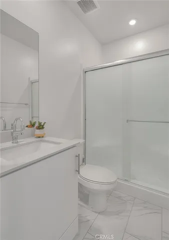 a view of swimming pool with outdoor seating and a pathway