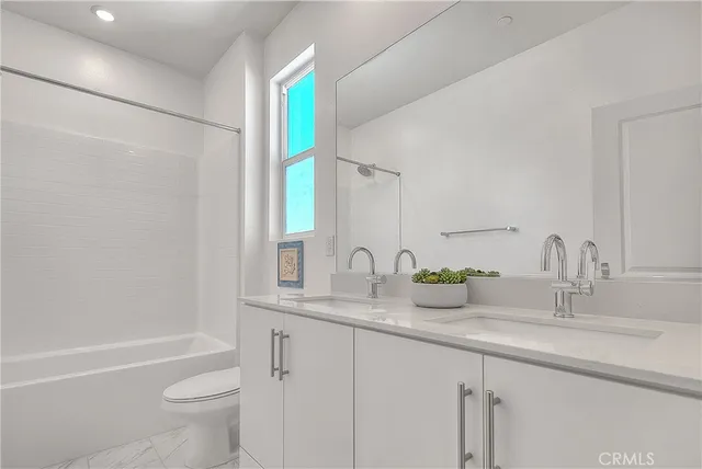 a building outdoor space with patio furniture and potted plants