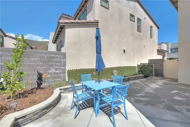 a view of a living room and floor to ceiling window