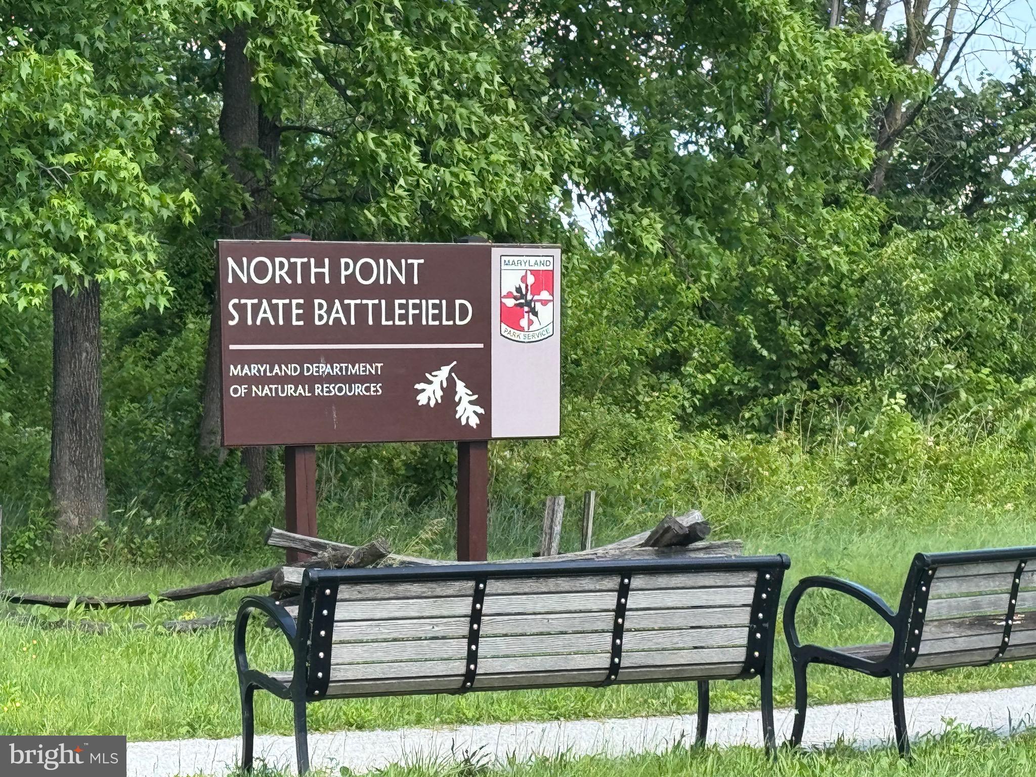 8024 Kimberly Road Dundalk, MD 21222 - Photo 12 of 16 a view of a street sign under a large tree