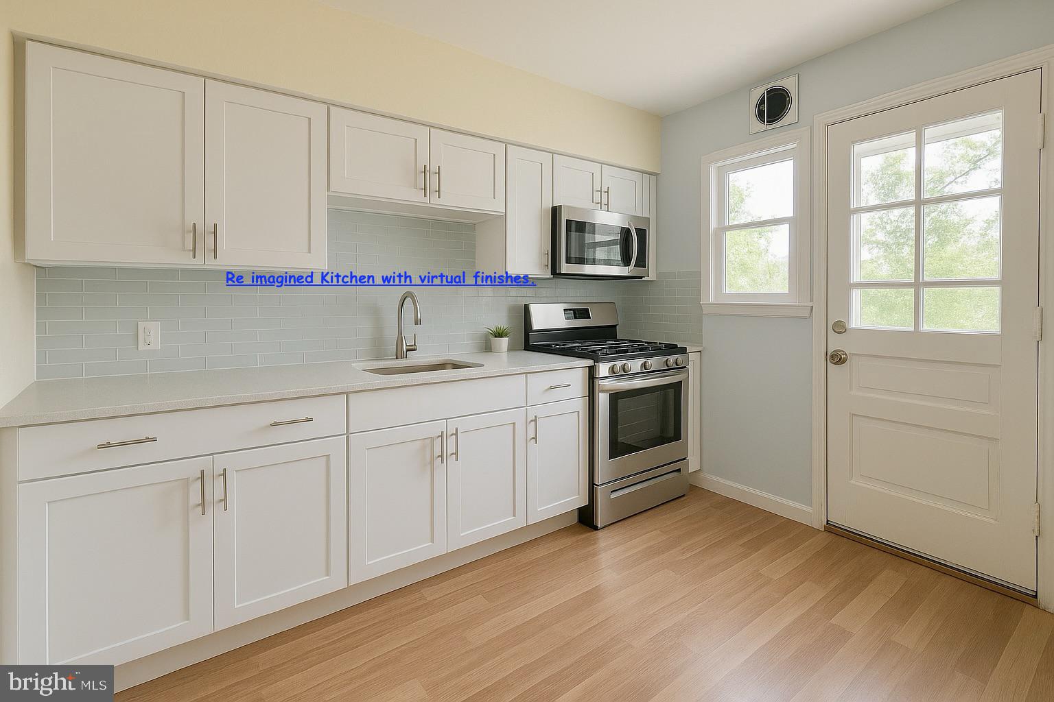 8024 Kimberly Road Dundalk, MD 21222 - Photo 8 of 16 a kitchen with granite countertop white cabinets and white appliances
