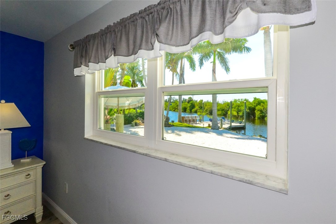 12082 Moon Shell Drive Matlacha Isles, FL 33991 - Photo 19 of 46 a view of a house with a window and outside view