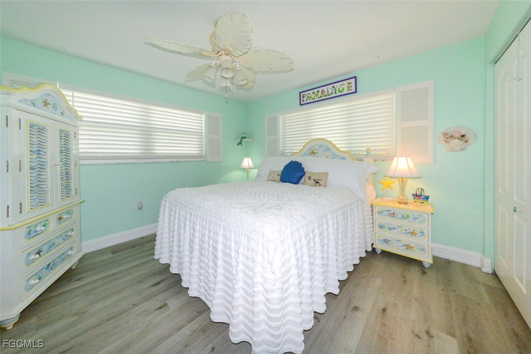 12082 Moon Shell Drive Matlacha Isles, FL 33991 - Photo 20 of 46 a bedroom with a bed and a window