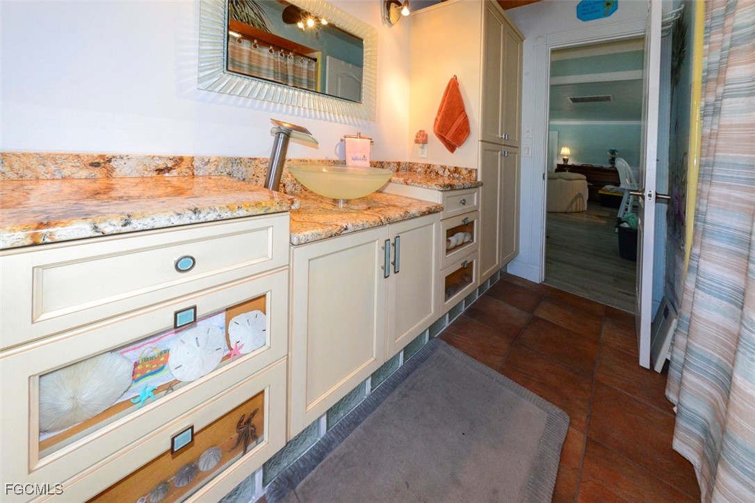 12082 Moon Shell Drive Matlacha Isles, FL 33991 - Photo 23 of 46 a utility room with washer and dryer