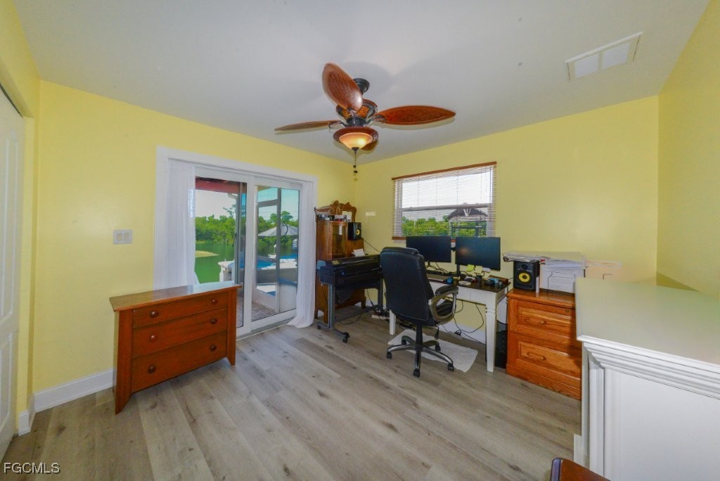 12082 Moon Shell Drive Matlacha Isles, FL 33991 - Photo 24 of 46 a room with furniture and wooden floor