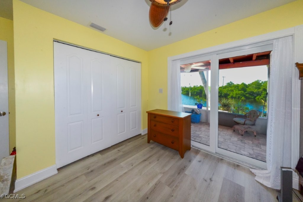 12082 Moon Shell Drive Matlacha Isles, FL 33991 - Photo 25 of 46 a view of a room with a window and wooden floor