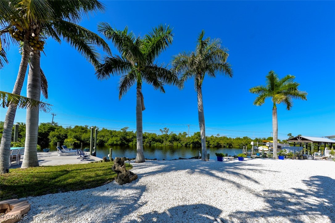 12082 Moon Shell Drive Matlacha Isles, FL 33991 - Photo 29 of 46 a view of a park with palm trees