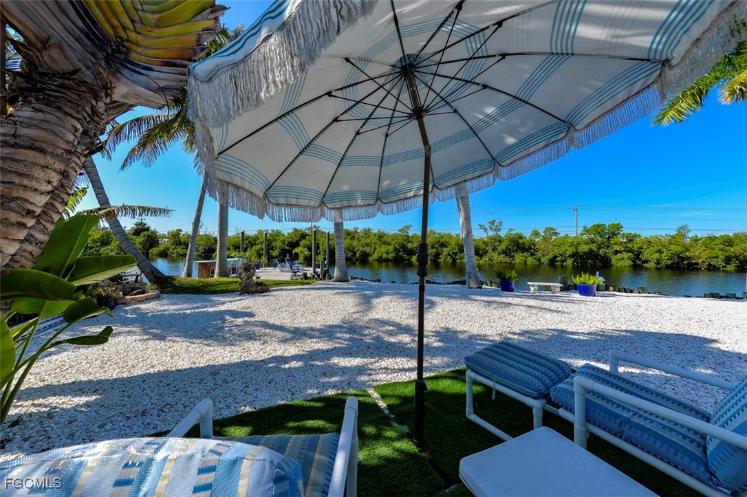 12082 Moon Shell Drive Matlacha Isles, FL 33991 - Photo 33 of 46 a view of a backyard with sitting area