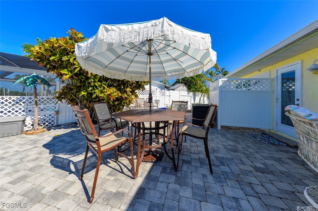 12082 Moon Shell Drive Matlacha Isles, FL 33991 - Photo 34 of 46 a view of a backyard with furniture and a table