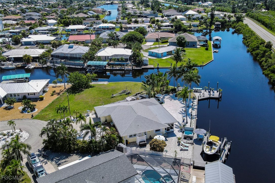 12082 Moon Shell Drive Matlacha Isles, FL 33991 - Photo 37 of 46 an aerial view of a houses with yard