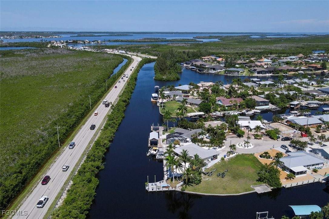12082 Moon Shell Drive Matlacha Isles, FL 33991 - Photo 39 of 46 a view of a city with an ocean