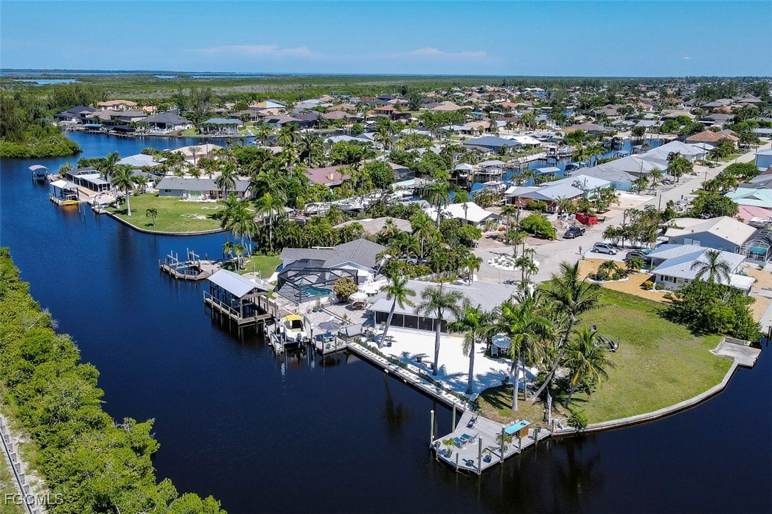 12082 Moon Shell Drive Matlacha Isles, FL 33991 - Photo 41 of 46 an aerial view of a house with a lake view