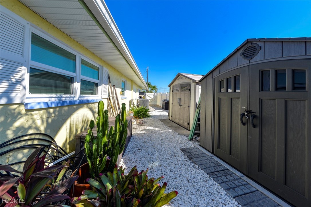 12082 Moon Shell Drive Matlacha Isles, FL 33991 - Photo 45 of 46 a view of a house with entryway and wooden fence