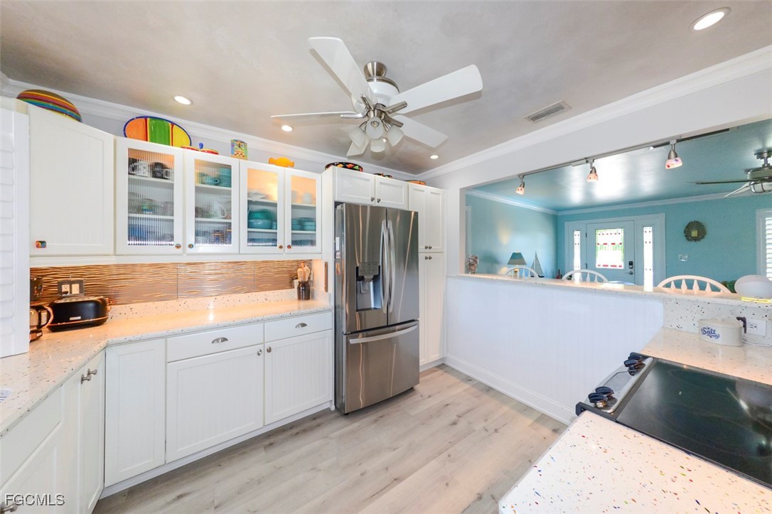 12082 Moon Shell Drive Matlacha Isles, FL 33991 - Photo 7 of 46 a kitchen with a sink appliances and cabinets
