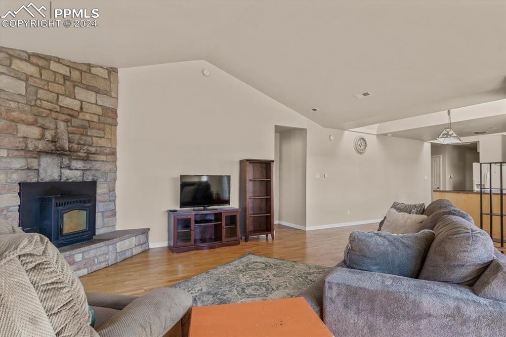 6670 Zercher Road Beulah, CO 81023 - Photo 14 of 37 a living room with furniture a flat screen tv and a fireplace