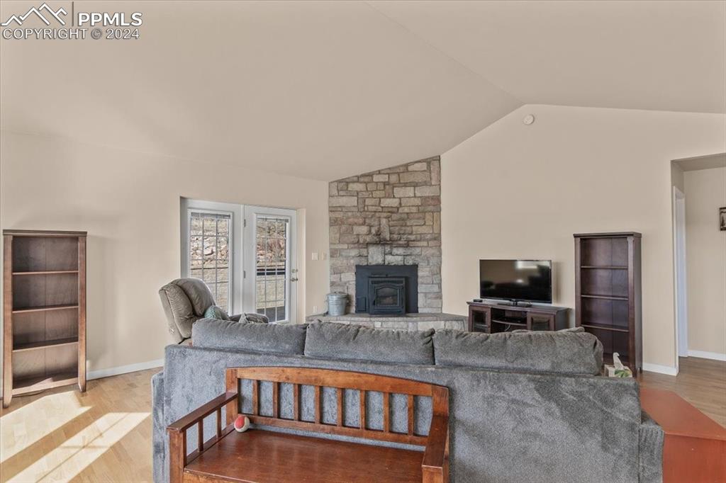 6670 Zercher Road Beulah, CO 81023 - Photo 15 of 37 a living room with furniture a fireplace and a flat screen tv