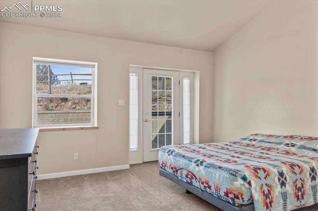 6670 Zercher Road Beulah, CO 81023 - Photo 26 of 37 a bedroom with a bed and a window