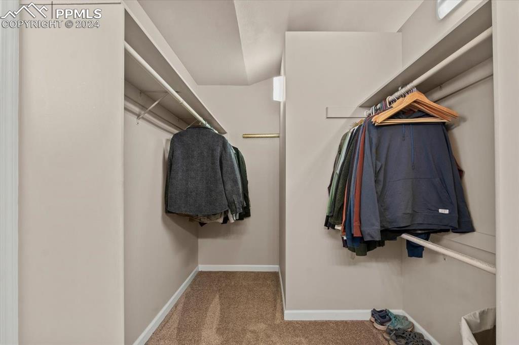 6670 Zercher Road Beulah, CO 81023 - Photo 28 of 37 a view of walk in closet with clothes and shoes