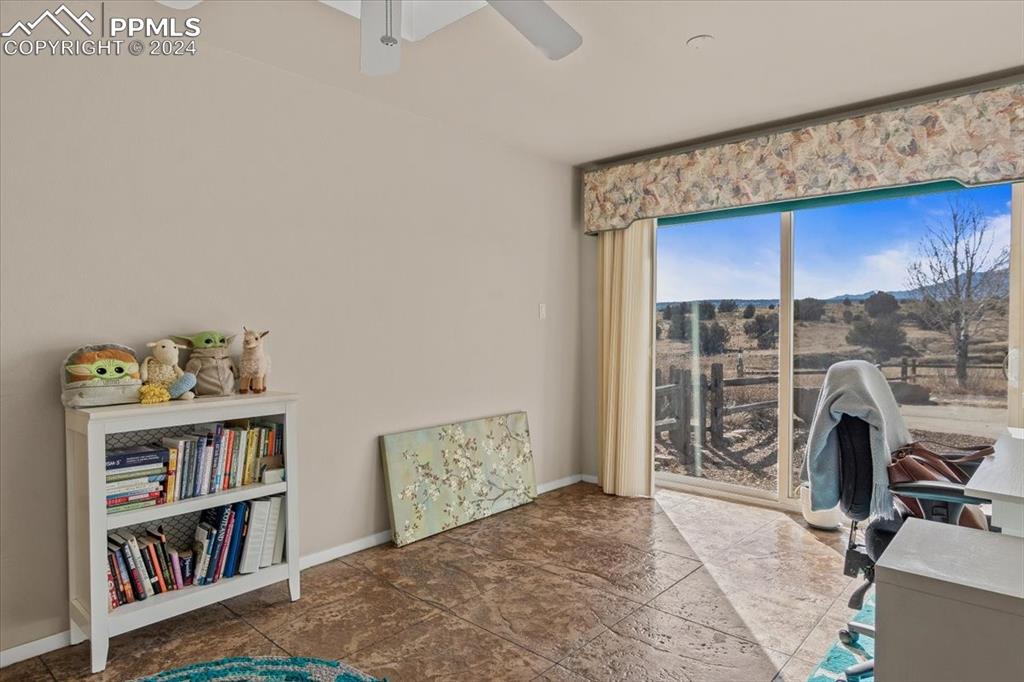 6670 Zercher Road Beulah, CO 81023 - Photo 30 of 37 a bedroom with a bed and a book shelf