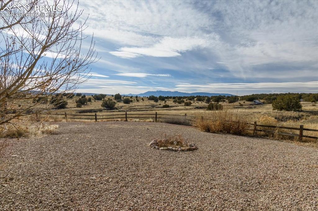 6670 Zercher Road Beulah, CO 81023 - Photo 31 of 37 a view of a dry yard with wooden fence