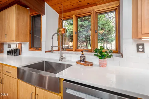 a kitchen with a sink and a window