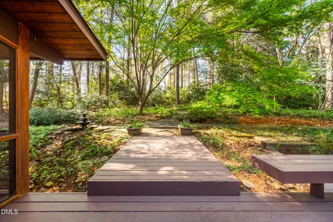 a view of backyard with outdoor seating