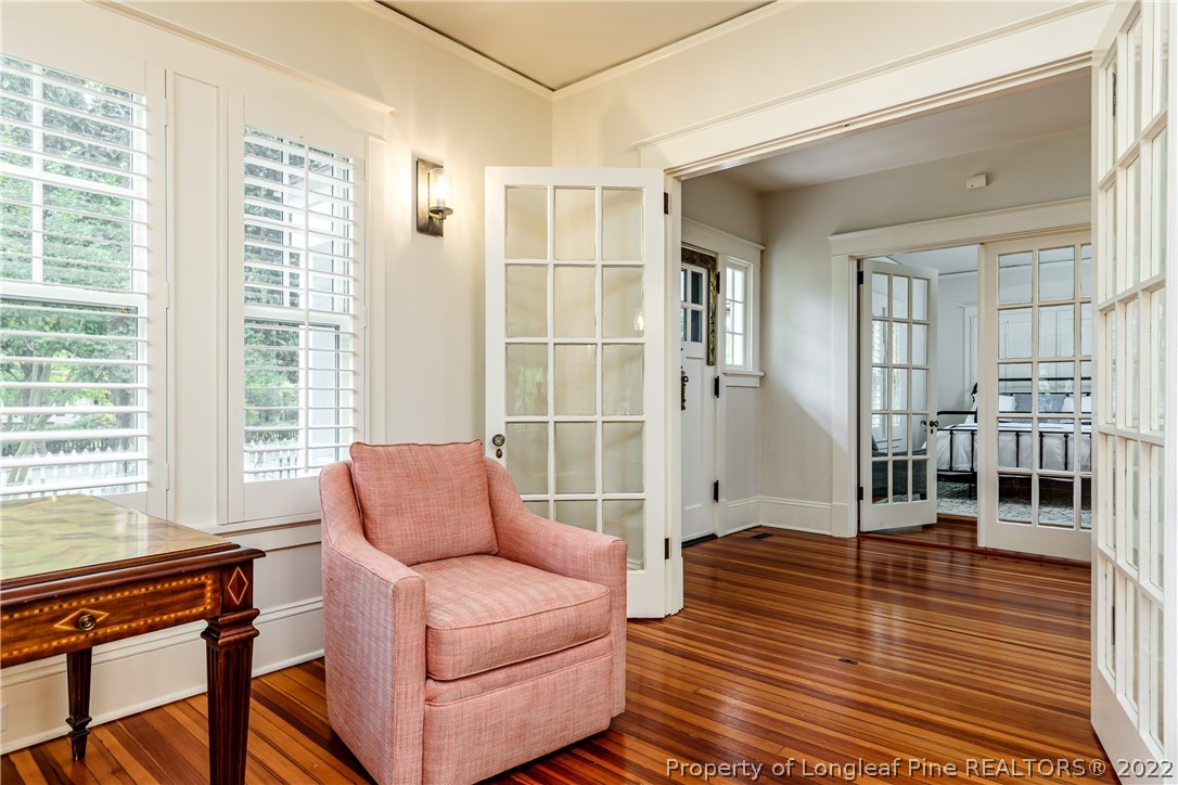 205 Cherokee Road Pinehurst, NC 28374 - Photo 18 of 39 a living room with furniture and wooden floor