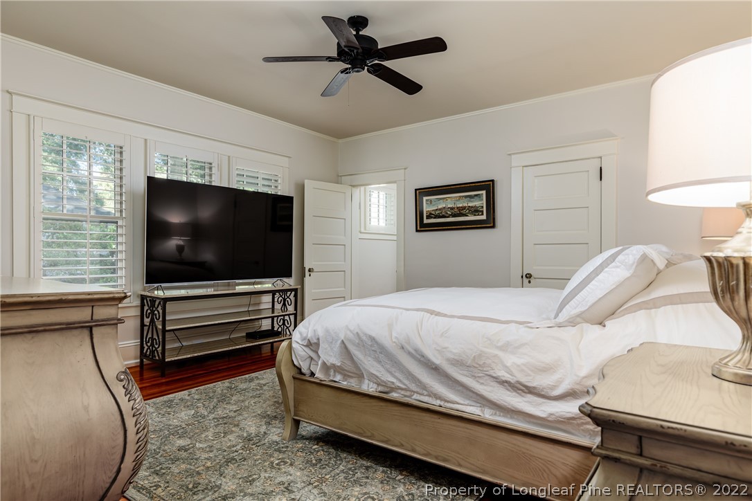 205 Cherokee Road Pinehurst, NC 28374 - Photo 22 of 39 a bedroom with a bed and a flat screen tv