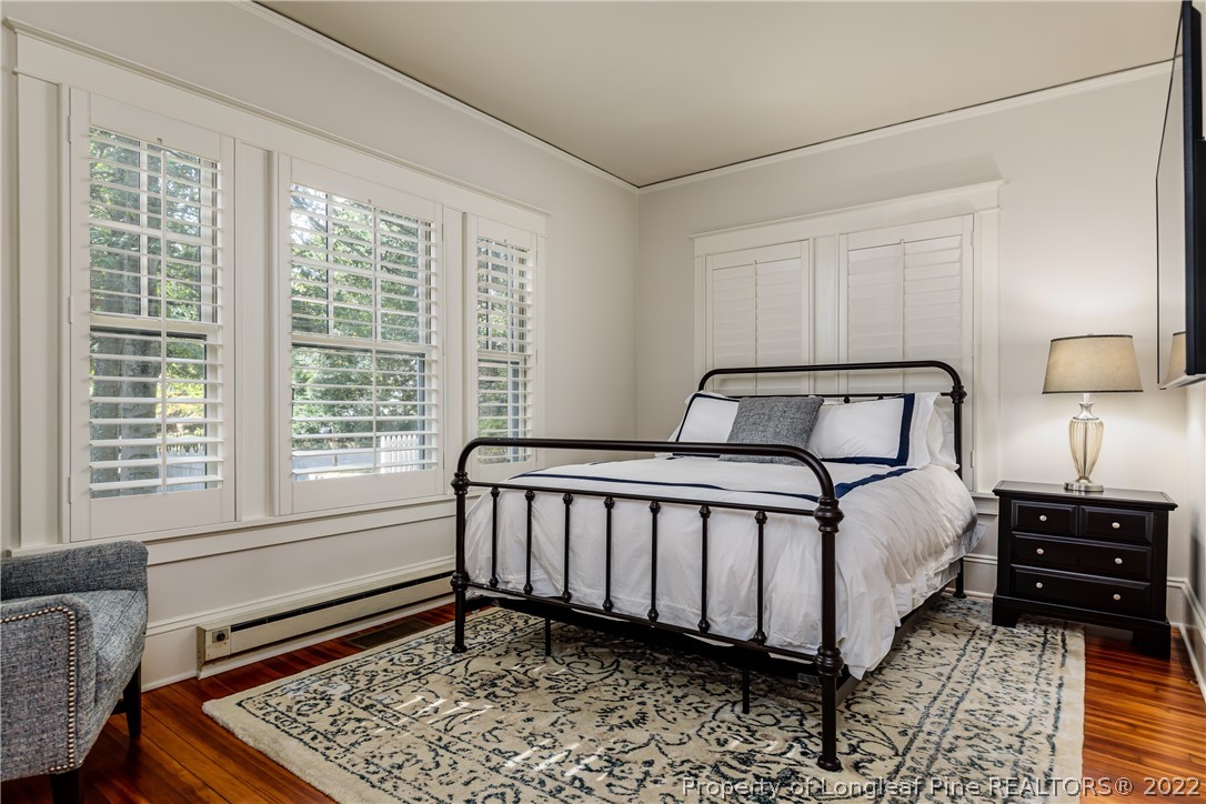 205 Cherokee Road Pinehurst, NC 28374 - Photo 10 of 39 a bedroom with a bed and a window