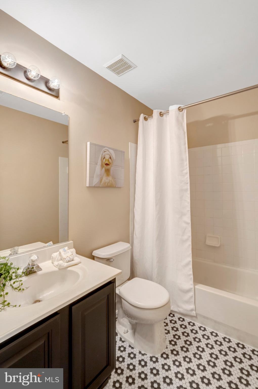 7706 Shadowcreek Terrace Springfield, VA 22153 - Photo 22 of 30 a bathroom with a sink a toilet and shower