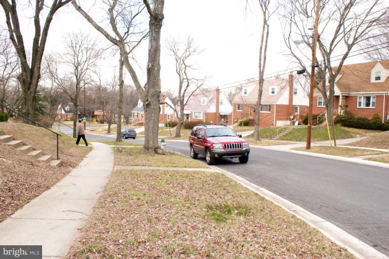 3710 Kayson Street Silver Spring, MD 20906 - Photo 1 of 24 a view of a yard and car parked